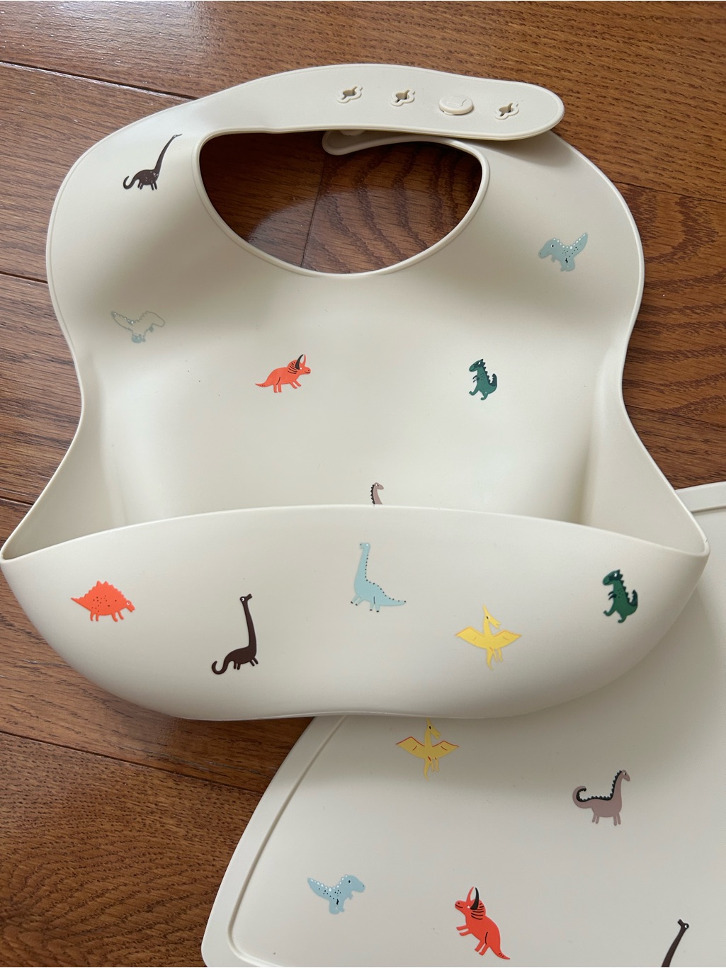 Mushie Dinosaur Print Silicone Bib/Matching Placemat And Aeiou Divided Plate Set — image 2 of 4